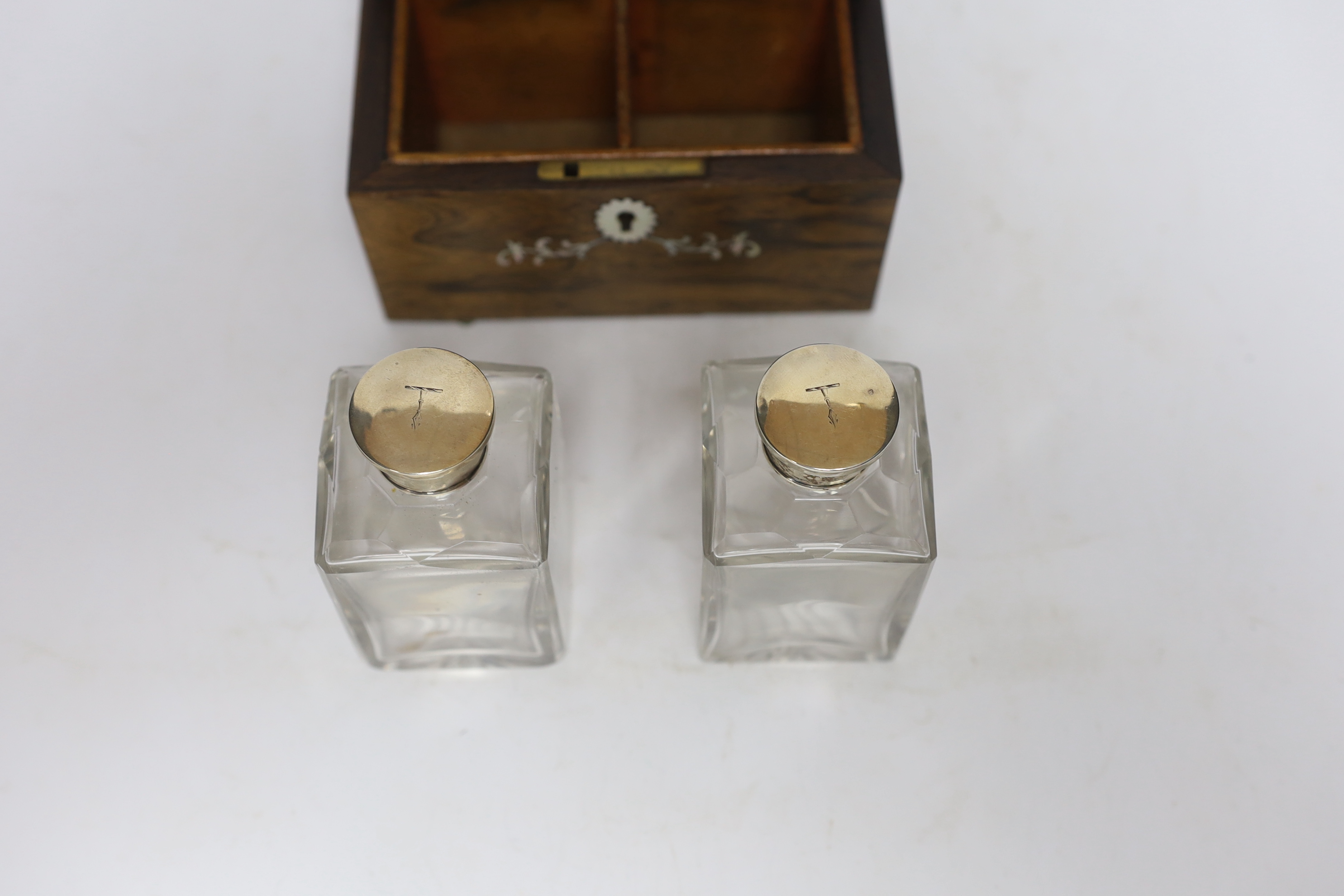 A 19th century mother-of-pearl inlaid rosewood travelling toilet box with two white metal mounted bottles, 14cm wide